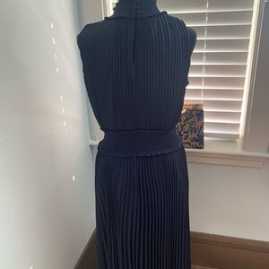 Nanette Lepire, Navy dress, calf length.